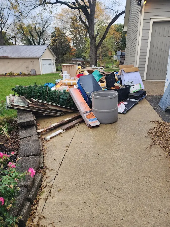 Dumpster being loaded with debris for 3 Yard Dumpster Rental in Fairfax